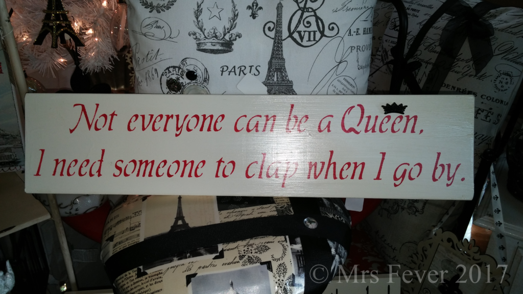 painted sign that says "Not everyone can be a Queen. I need someone to clap when I go by."