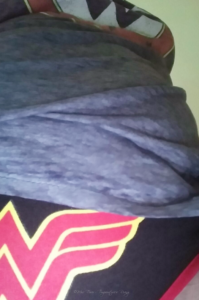 up-shot of woman wearing Wonder Woman underwear and T-shirt