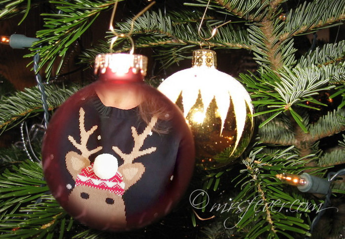 photo of reindeer Christmas sweater superimposed on glass Christmas ornament