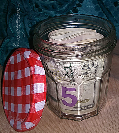The Money Jar -- jam jar filled with money