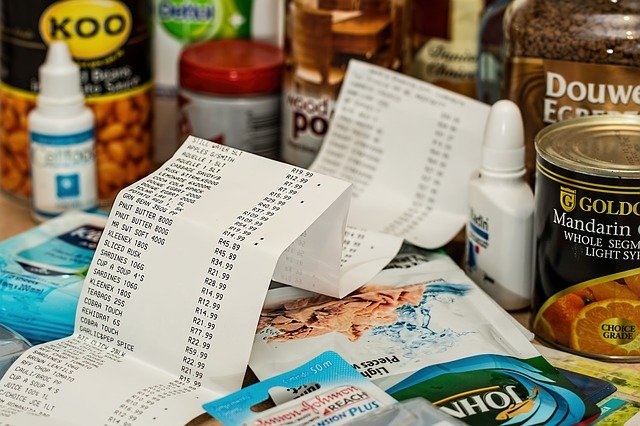 grocery receipt laid over packages of food, image from pixabay